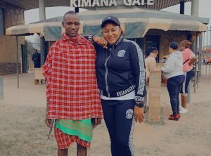 Africa Kenya and Tanzania safari tours Sole traveler visiting maasai village